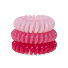 Load image into Gallery viewer, A tower of 3 pretty in pink different coloured hair bobbles called spirabobbles. A plastic spiral circular hair tie spira bobble.
