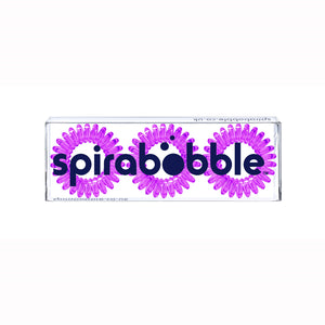 A flat transparent box of 3 purple berry coloured hair accessories called spirabobbles