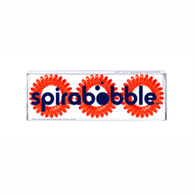 Load image into Gallery viewer, A flat transparent box of 3 red coloured hair accessories called spirabobbles
