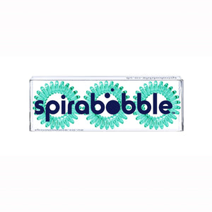 A flat transparent box of 3 serene green coloured hair accessories called spirabobbles