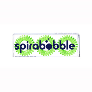 A flat transparent box of 3 spring green coloured hair accessories called spirabobbles.