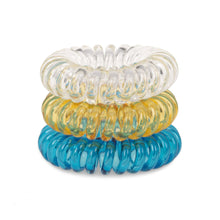 Load image into Gallery viewer, A tower of 3 different coloured hair bobbles called spirabobbles. A plastic spiral circular hair tie spira bobble.
