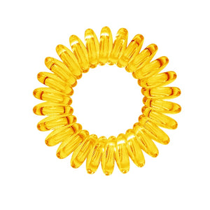 A sunflower yellow solid coloured plastic circular hairband on a white background that looks like an old fashioned curly coiled telephone cable or a coiled spring which has been made into a circular shape