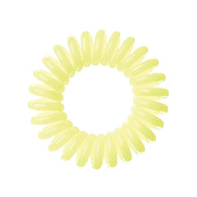 Load image into Gallery viewer, A pale yellow lemon pie coloured plastic spiral circular hair bobble on a white background called a spirabobble.
