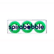 Load image into Gallery viewer, A flat transparent box of 3 lime green coloured hair accessories called spirabobbles
