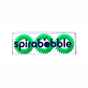 A flat transparent box of 3 lime green coloured hair accessories called spirabobbles