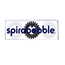 Load image into Gallery viewer, A flat transparent box of 2 white and 1 black coloured hair accessories called spirabobbles
