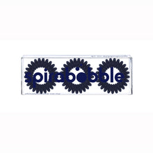 Load image into Gallery viewer, A flat transparent box of 3 navy blue coloured hair accessories called spirabobbles
