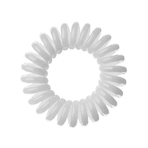 A pale grey coloured plastic spiral circular hair bobble on a white background called a spirabobble.