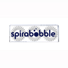 Load image into Gallery viewer, A flat transparent box of 3 pale grey coloured hair accessories called spirabobbles
