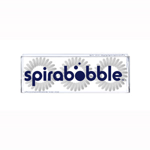 A flat transparent box of 3 pale grey coloured hair accessories called spirabobbles