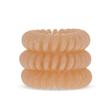 Load image into Gallery viewer, A tower of 3 Perfectly Peach coloured hair bobbles called spirabobbles. A plastic spiral circular hair tie spira bobble.
