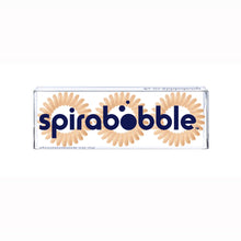 Load image into Gallery viewer, A flat transparent box of 3 Perfectly Peach coloured hair accessories called spirabobble
