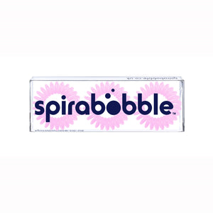 A flat transparent box of 3 pink coloured hair accessories called spirabobbles