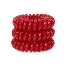 Load image into Gallery viewer, A tower of 3 red coloured hair bobbles called spirabobbles. A plastic spiral circular hair tie spira bobble.
