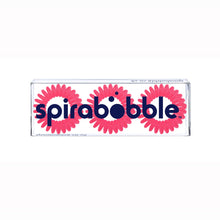 Load image into Gallery viewer, A flat transparent box of 3 rose pink coloured hair accessories called spirabobbles
