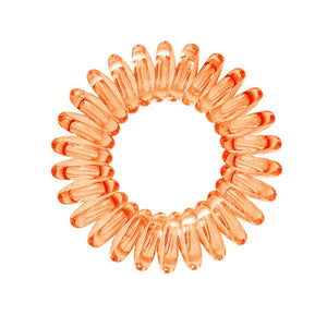 A Tangerine Orange coloured plastic spiral circular hair bobble on a white background called a spirabobble.