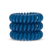 Load image into Gallery viewer, A tower of three (placed on top of each other) turquoise blue solid coloured plastic spiral circular hair bobbles on a white background that looks like an old fashioned curly coiled telephone cable or a coiled spring which has been made into a circular sh
