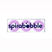 Load image into Gallery viewer, A flat transparent box of 3 Violet Cream coloured hair accessories called spirabobbles.
